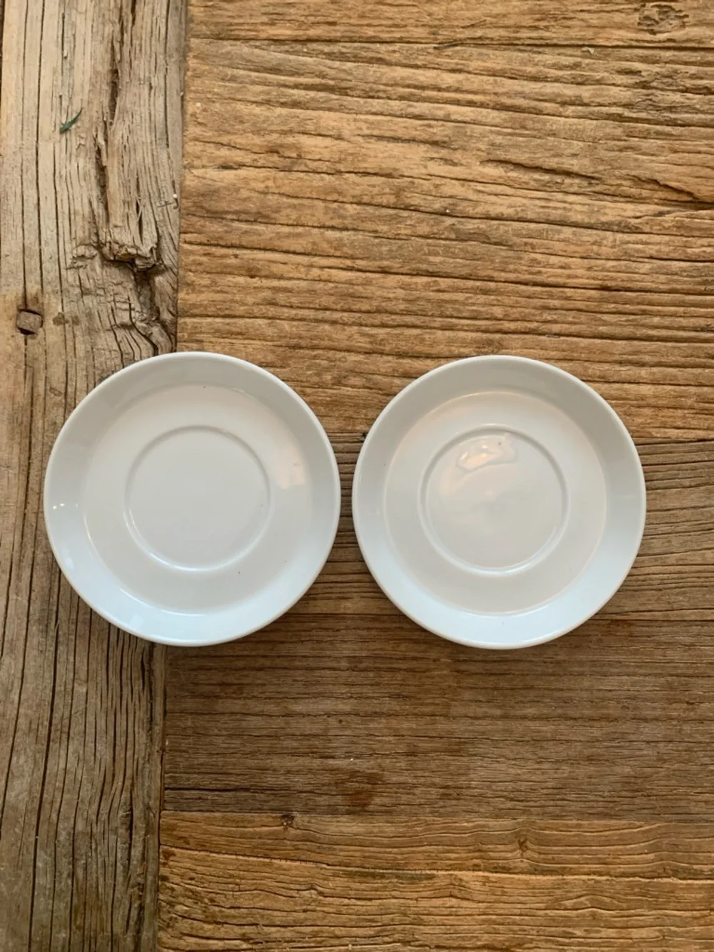 Two Crate and Barrel Espresso Saucers